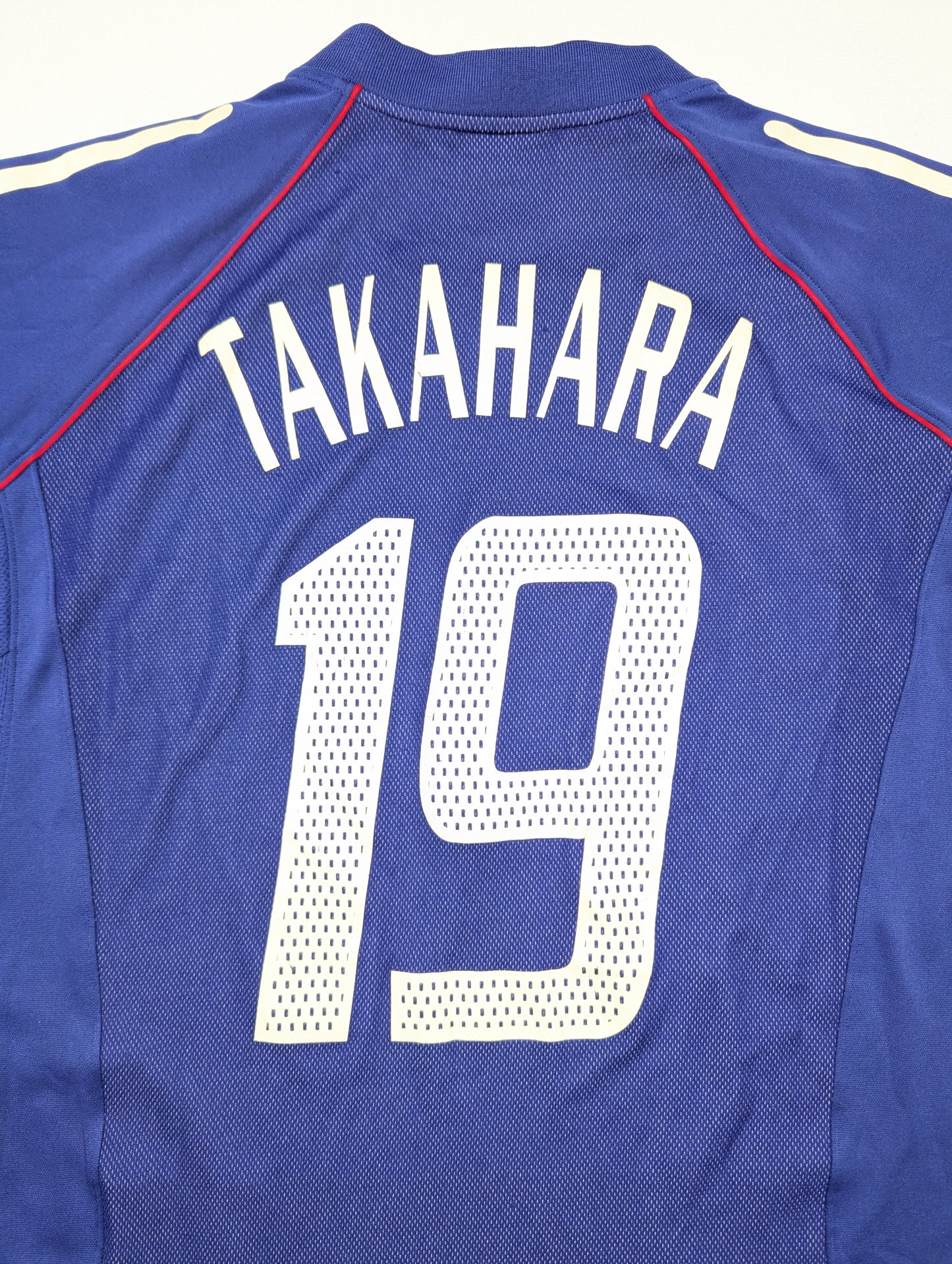 Blue sports jersey with 'Takahara' and number '19' on a white background