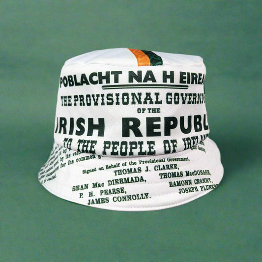 White bucket hat with text and Irish tricolor design on a gray background