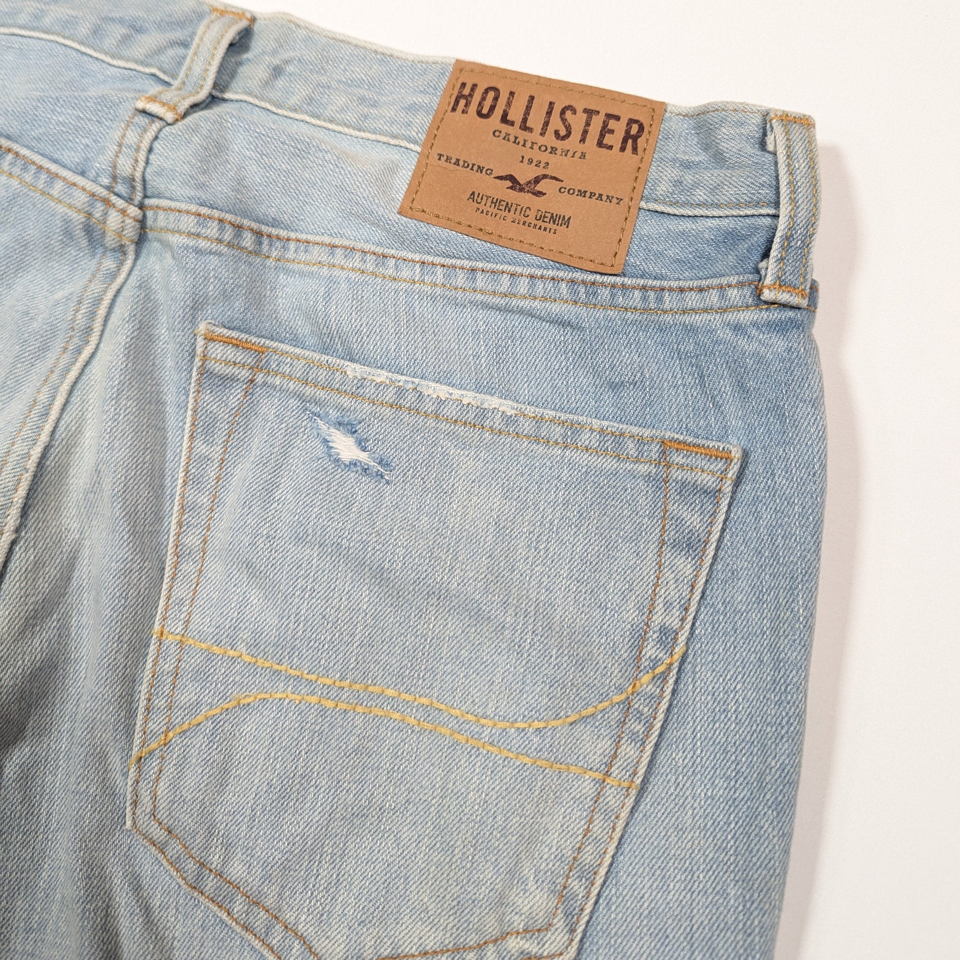 Light blue denim jeans with a Hollister label on a white background