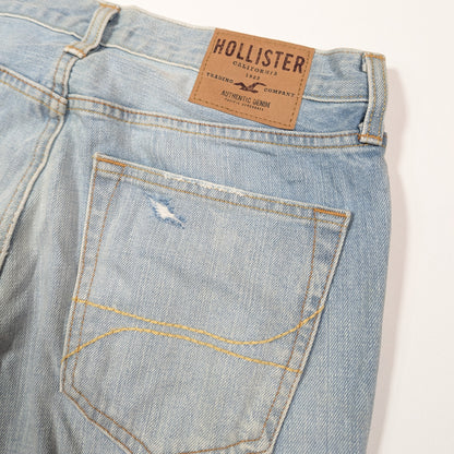 Light blue denim jeans with a Hollister label on a white background