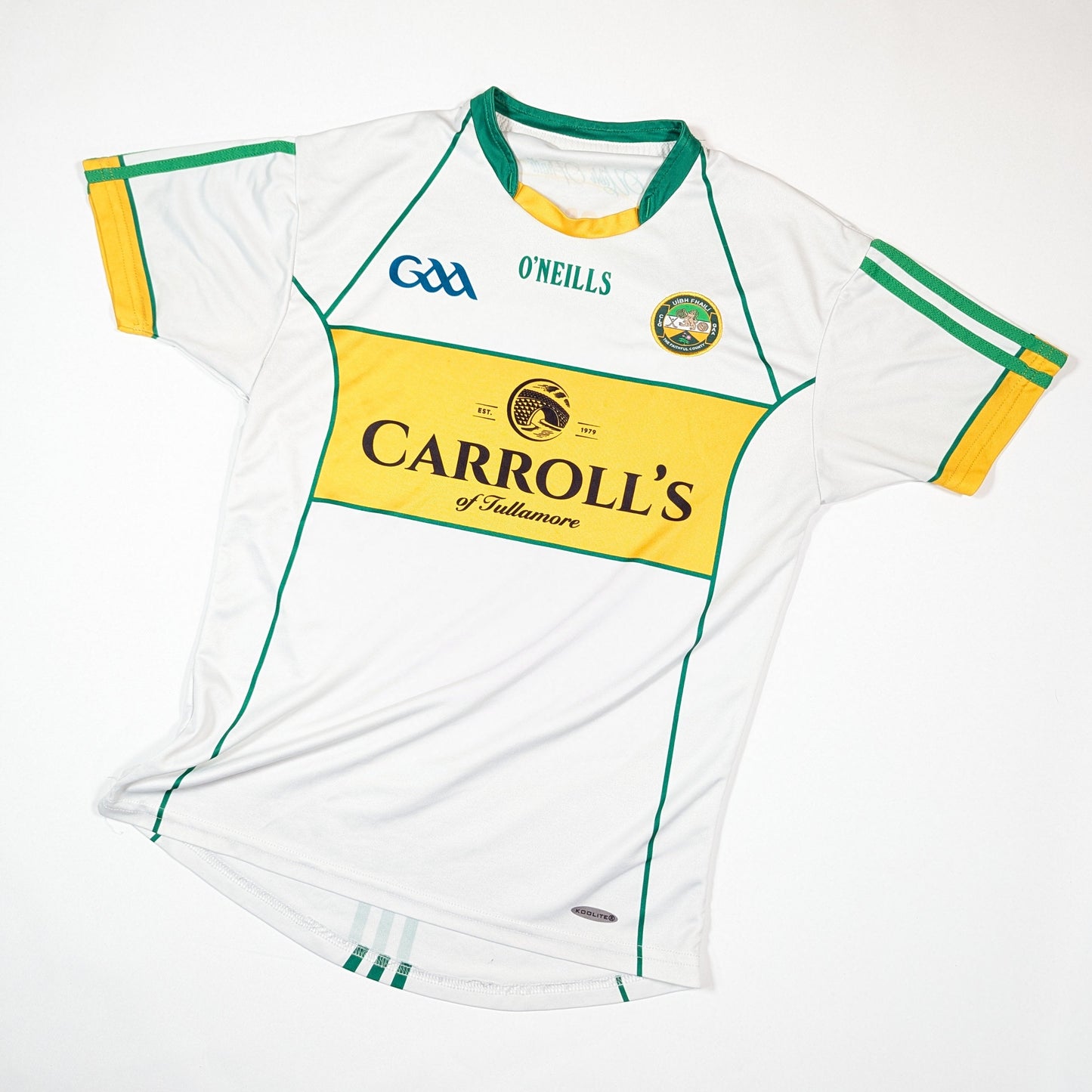 White sports jersey with green and yellow accents, featuring O'Neills and Carroll's logos on a white background.