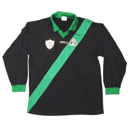 A black and green long-sleeved GAA jersey from the 1990s, featuring a diagonal green stripe, a collar, and the O'Neills brand logo.